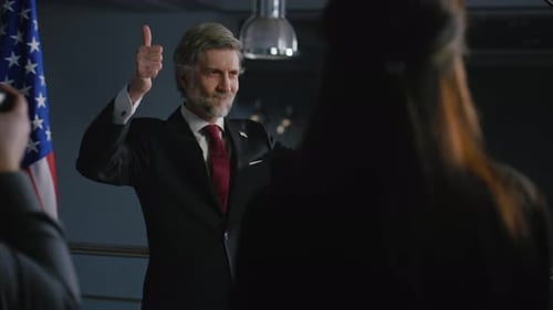 Politician Poses for Photos at Press Conference