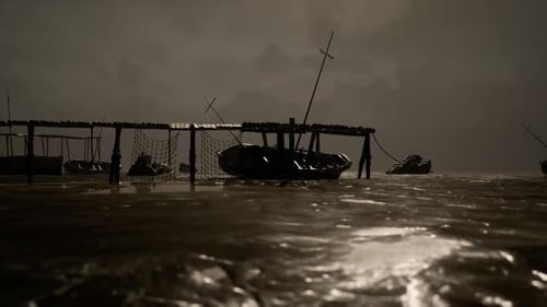Dark Waters Surround Fishing Boats at Dusk with Cloudy Skies