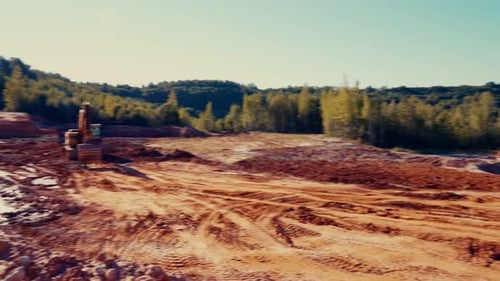 Heavy Equipment Hauling Soil in Rural Construction Site