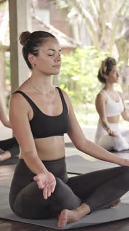 Women Practicing Meditation at Tropical Yoga Retreat