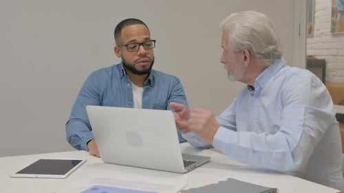 Business People Discussing Project in Office