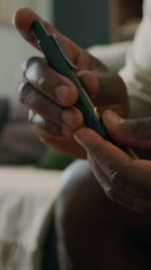 Close-Up of Man Testing Blood with Glucose Meter Device