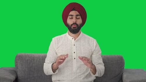 Sikh Indian man doing Yoga Green screen