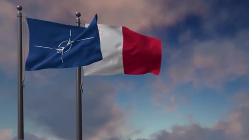 NATO and France Flags Waving Against Blue Sky