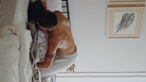 Happy Boyfriend Jumping Wife Laying Bed Couple Having Fun at Bedroom Vertical