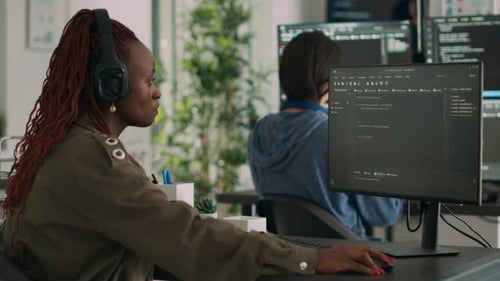 African American Software Engineer Working Focused on Programming It Language