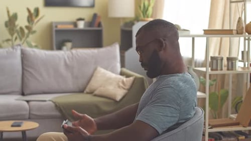 Portrait of Black Man with Digital Tablet at Home