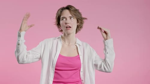 Irritated Sarcastic Woman Showing Blabla Gesture Hands on Pink Background