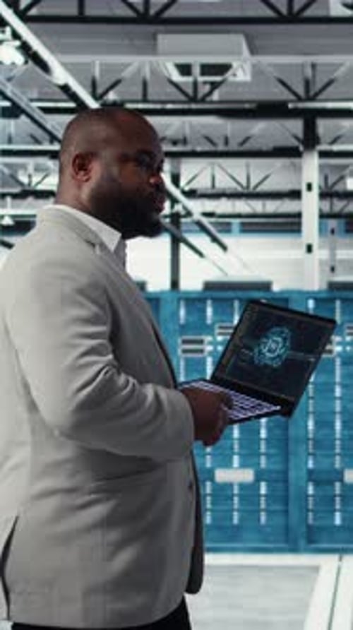 Vertical Video Data Center Admin Doing IT Maintenance Tasks Using AI Technology