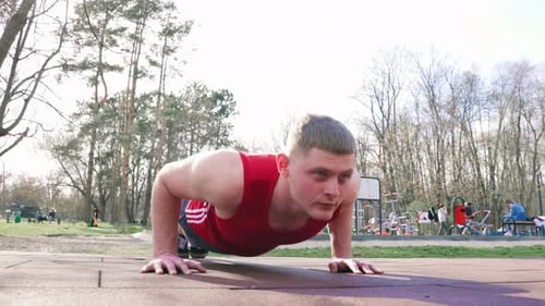 Athletic Young Man Training Outdoors