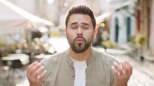 Young Man Looking Surprised at Camera Shocked By Sudden Win Good Victory News Wow in City Street