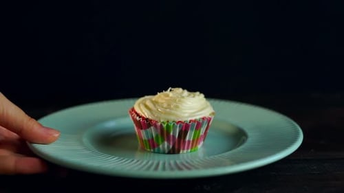 Tasty Cupcake on Plate Being Removed