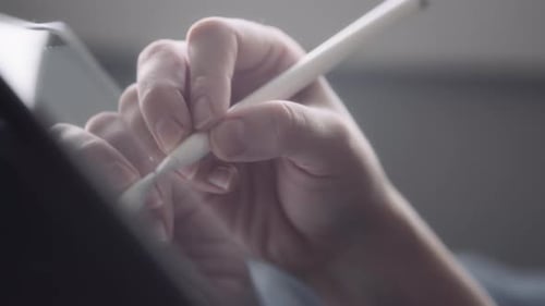 Woman Hand Using Digital Pen on Tablet Close Up