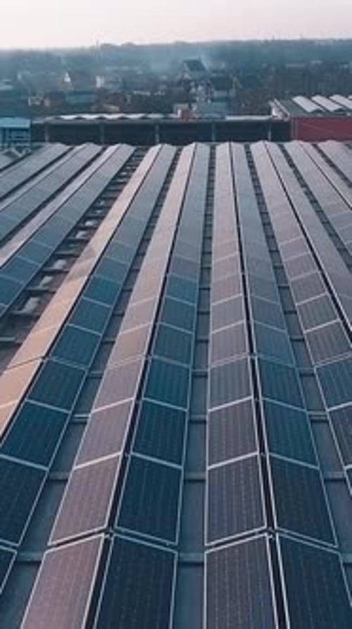 Factory roof with solar panels. Aerial view of the solar energy on rooftop