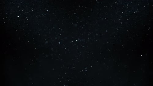 Dust particles slowly flowing in the air