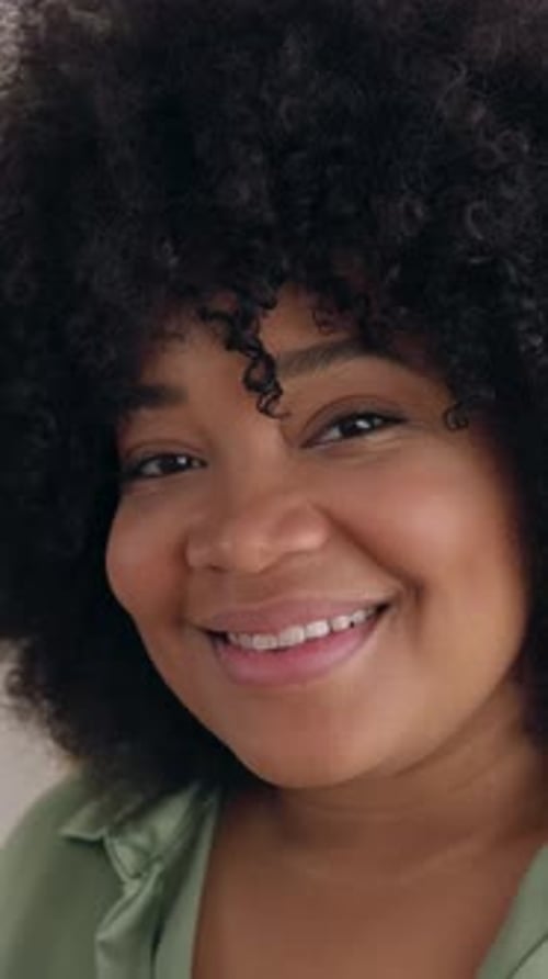 Portrait of Smiling Professional Woman Looking at Camera Standing in an Office