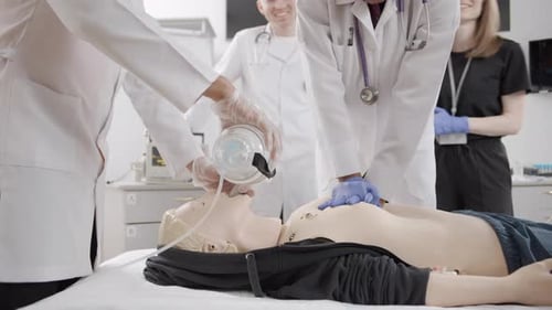 Life lessons: doctors demonstrate first aid techniques on a mannequin