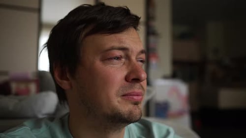 Sad Man Crying with Tears Streaming Down His Face