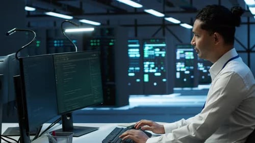 Portrait of Upbeat Admin in Data Center Managing Servers