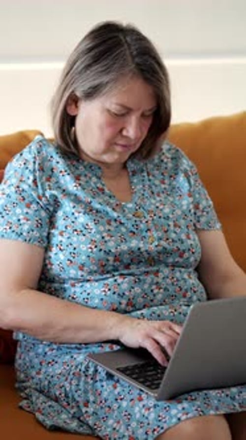 Woman Working From Home on Laptop