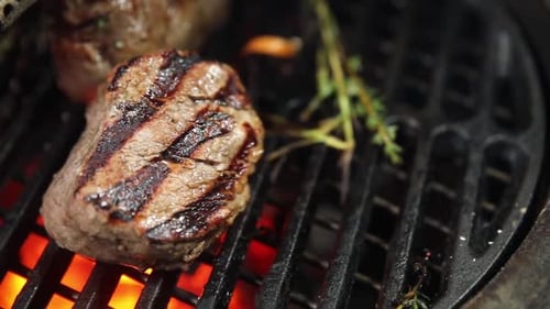 Juicy Seasoned Steak Cooking on a Hot Grill