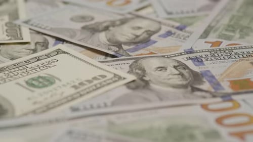 Pile of US One Hundred Dollar Bills