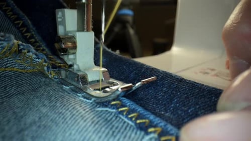 Stitching in Slow Motion Footage of Sewing Machine Stitching Zipper on the Fabric Garment Making and