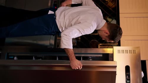 Vertical Video Professional Kitchen Chef Looks Into the Fridge and Chooses Ingredients for Cooking