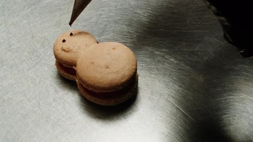 Close Up Decorating Small Pink Macarons