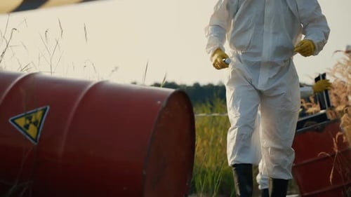Scientists Examining Toxic Waste Area with Caution Tape