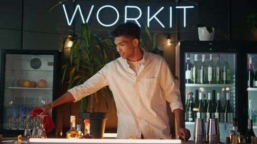 Positive Man Wiping Dishes Cafe Bar Counter Black Skin Barista Looking Camera