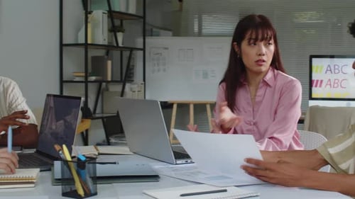 Young Adults Collaborating at an Office Conference Table