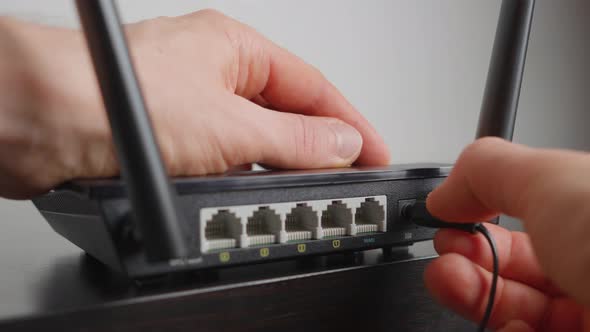 Man plugging in a WiFi router. Close up, Technology Stock Footage ft ...