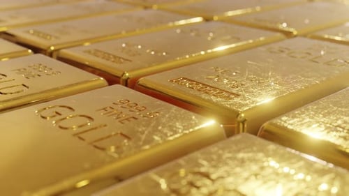 Lingots d'or soigneusement empilés et symbolisant le luxe, la richesse et la sécurité financière 4k