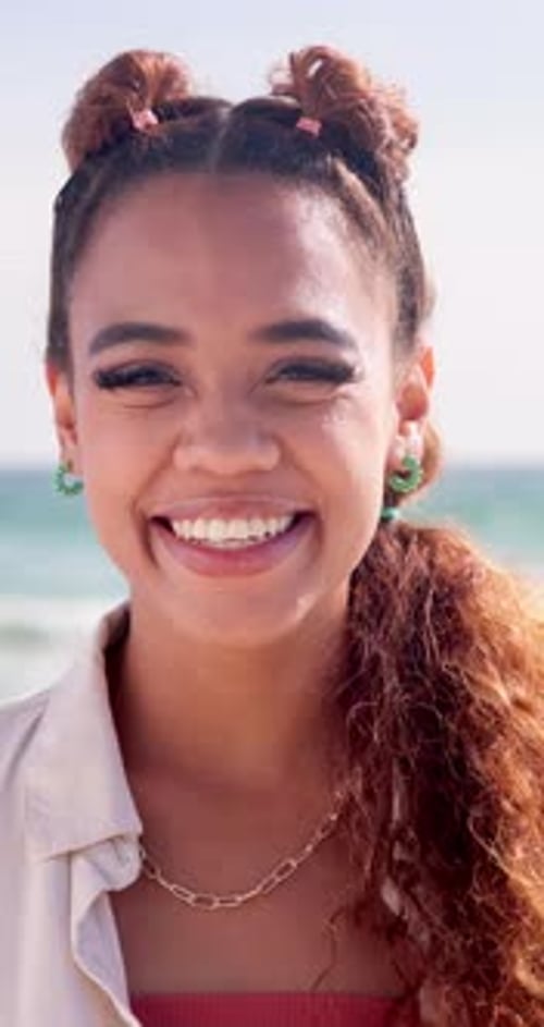 Girl, beach and smile for vacation, portrait and happiness for travel, holiday and nature of water