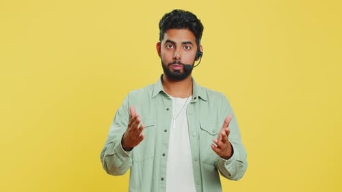 Indian Man Freelance Worker in Headset Call Center Support Service Operator Helpline Having Talk
