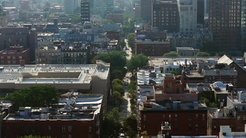 Aerial View of New York City's Bustling Manhattan Highlighting Iconic Redbrick Buildings and Square