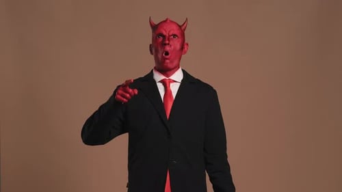 Red Devil Businessman Pointing Finger Making Facial Expressions