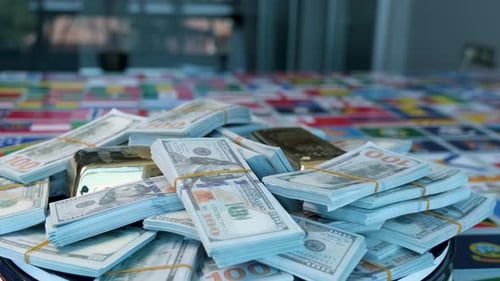 Stacks of US Currency and Gold on Flags