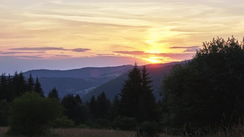 Sunset in the Mountain Forest Landscape in Summer Pastel Color of the Sky