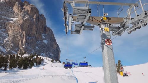 FPV POV of Cable Chair Ski Lift Ascend for Alpine Skiing in Dolomites Italy