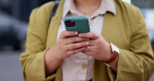 Phone, hands and typing in city, social media or texting outdoor in urban street