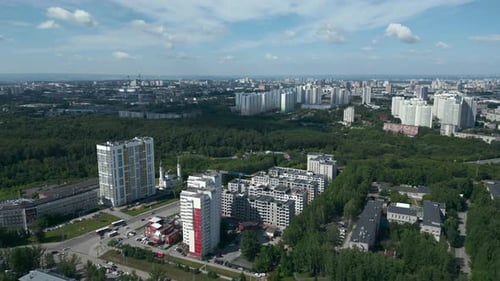 Cityscape Aerial View with Buildings, Trees, and Roads