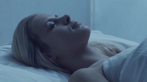 Young Woman Lying in the Bed at Night and Having Insomnia Disease Beautiful Blond Sleeping Girl