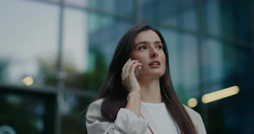 Front Camera View of Gorgeous Caucasian Female in Stylish Business Suit Woman Walking Away From