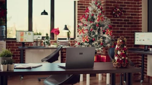 Empty Startup Office Decorated with Christmas Lights and Tree