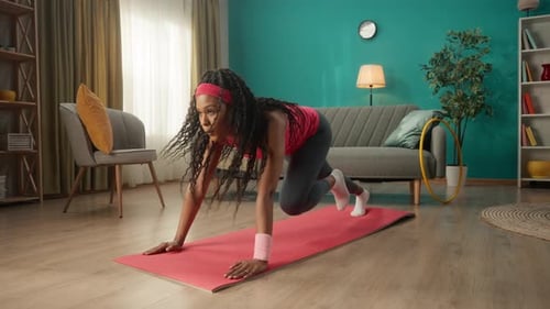 A Woman Goes in for Sports Mountain Climber Runs in an Emphasis Lying Down African American Woman