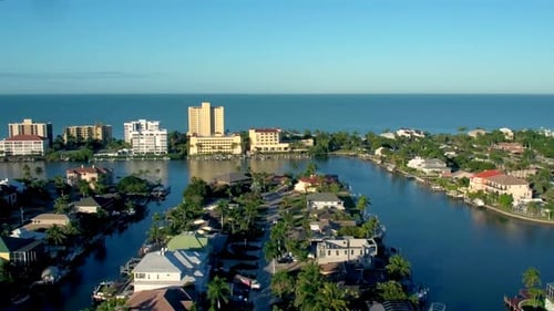 Luxury homes along the naples Florida coastline by aerial drone on a sunny day