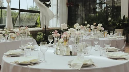 Wedding Reception Tablescapes with Flowers and Elegant Place Settings
