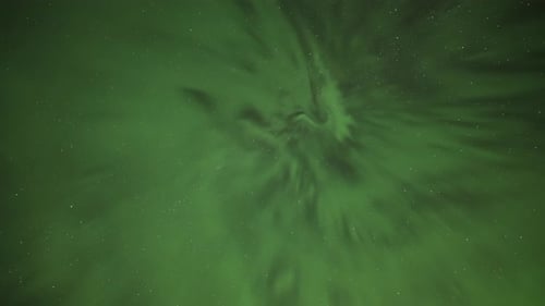 An enchanting spectacle of the colorful northern lights in the dark sky. A timelapse video.